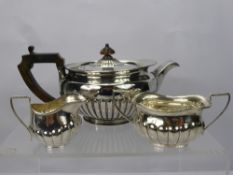 A Silver Tea Trio comprising tea pot, milk jug and sugar bowl, tea pot London hallmark dd 1805, mm