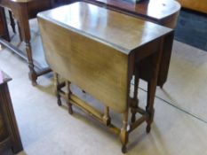 A Small Rectangular Oak Drop Leaf Table, approx 108 x 75 x 72 cms.