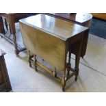 A Small Rectangular Oak Drop Leaf Table, approx 108 x 75 x 72 cms.