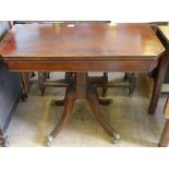 A Victorian Mahogany Inlaid Tea Table, supported on pedestal base with four reeded legs