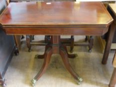 A Victorian Mahogany Inlaid Tea Table, supported on pedestal base with four reeded legs