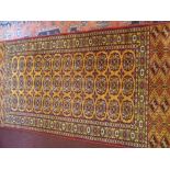 A 20th Century Persian Woollen Rug, burgundy on ochre ground 36 central gül, , surrounded by