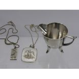 A Silver Cream Jug, Sheffield hallmark, mm H.W, together with two silver pendants on chains,