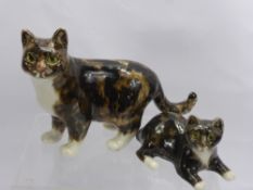 Two Jenny Winstanley Porcelain Cats, 'Standing Tabby' and 'Seated Tabby' both with glass eyes. (2)