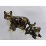 Two Jenny Winstanley Porcelain Cats, 'Standing Tabby' and 'Seated Tabby' both with glass eyes. (2)