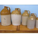 A Miscellaneous Collection of Pottery Ale Jugs, including C. Ward, Lamb Hotel, Cheltenham, John