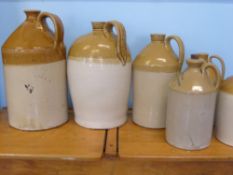 A Miscellaneous Collection of Pottery Ale Jugs, including C. Ward, Lamb Hotel, Cheltenham, John