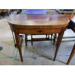 A Mahogany Card Table, on tapered legs with green baize and decorative inlay.