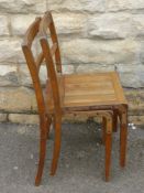 Eight Vintage Oak Kitchener Stacking Chairs.
