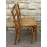 Eight Vintage Oak Kitchener Stacking Chairs.