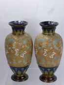 A Pair of Royal Doulton Lambeth Ware Vases, the vases having floral gilded decoration to body with