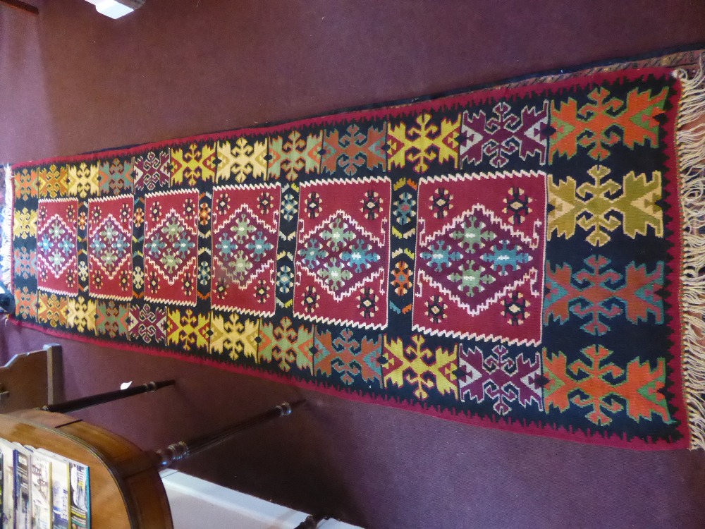 A 20th Century Turkish Tekke Kilim Runner, with geometric design in burgundy, turquoise, green