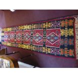 A 20th Century Turkish Tekke Kilim Runner, with geometric design in burgundy, turquoise, green