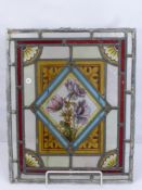Four Lead Lined Stained Glass Panels, hand painted. Panel 1 depicting daffodils, panel 2 iris, panel