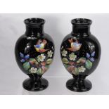 A Pair of Black Glass Painted Enamelled Vases, depicting birds and flowers, approx 28 cms high. (2)