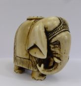 A Meiji Period Japanese Ivory Netsuke, depicting an Asian elephant, approx 4 x 4 cms, no character