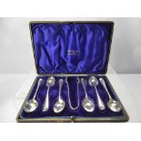 A Set of Six Silver Coffee Spoons and Sugar Nips, Chester hallmarkl dd 1907, mm Walker & Hall,