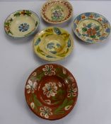 Five Antique Hungarian Peasant Pottery Bowls, hand painted with floral design.