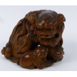 Edo/Meiji Period Japanese Netsuke, carved box wood netsuke depicting a crouching Shi-Shi.