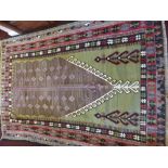 A 20th Century Turkish Kilim Woollen Rug of geometric design, with olive, blue, black and burgundy