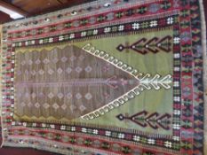 A 20th Century Turkish Kilim Woollen Rug of geometric design, with olive, blue, black and burgundy