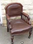 A Mahogany and Leather Smoker's Chair, on turned legs.