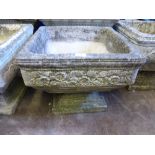 Three Square Tapering Composite Stone Garden Planters, raised on plinths. (3)