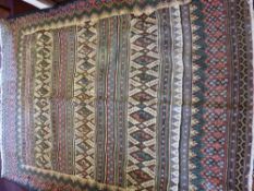 A 20th Century Tribal Rug, with stripes and geometric design in pink, blue and green, with floral