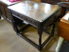 An Antique Mahogany Occasional Table, with decorative carving and pie crust edge, on turned legs