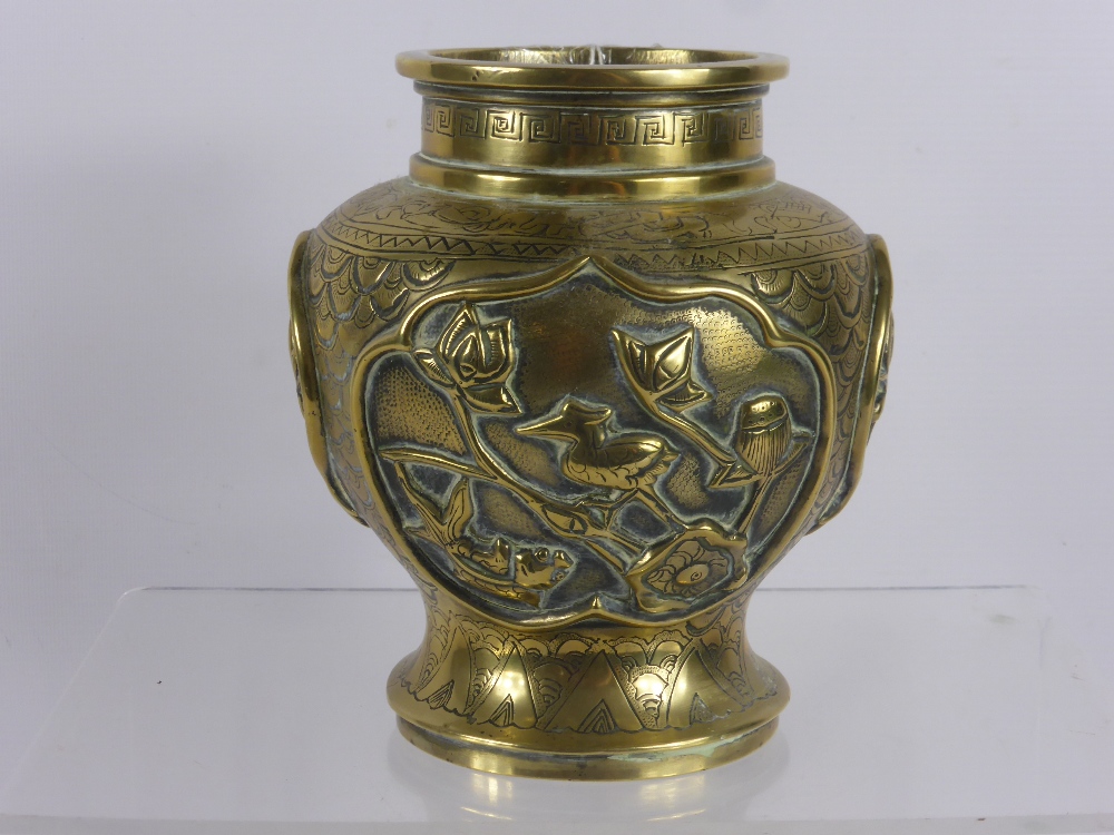 An Antique Chinese Brass Vase, with raised decoration depicting flowers, birds and tigers, character