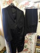 A Vintage Hand Made Black Wool Barathea Tail Coat and Trousers, the two piece set hand made by