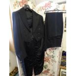 A Vintage Hand Made Black Wool Barathea Tail Coat and Trousers, the two piece set hand made by