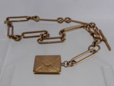 An Edwardian 9ct Gold Fob Chain and Stamp Envelope, approx 57.8 gms.