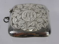 A Solid Silver Match Vesta, the vesta having floral engraving with engraved central cartouche,