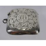 A Solid Silver Match Vesta, the vesta having floral engraving with engraved central cartouche,