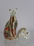 A Crown Derby Paper Weight of a Seated Cat, together with a Crown Derby paper weight of a rabbit. (