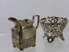 A Victorian Cream Jug, London hallmark, dd 1889, mm H.S., together with a Victorian silver bowl of