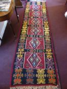 A 20th Century Turkish Tekke Kilim Runner, with geometric design in burgundy, turquoise, green