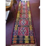 A 20th Century Turkish Tekke Kilim Runner, with geometric design in burgundy, turquoise, green