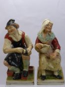 A 19th Century Staffordshire Figure of a Cobbler and his Wife, raised on square cut base, approx