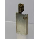 A Solid Silver Vintage Dunhill Lighter, the engine turned lighter initialled D.W.V., London hallmark