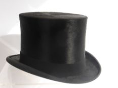 A Gentleman's Black Silk Top Hat, size 7.1/4, the hat in original Joshua Taylor, Cambridge box.