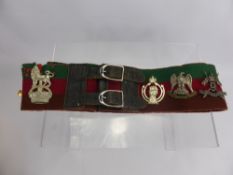 A Military Trophy Belt, featuring 11 badges of the Royal Armoured Corps.