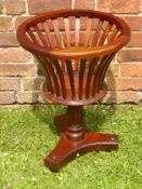 A Victorian Mahogany Planter, the planter having turned column on ball feet.