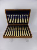 A Set of Twelve Silver Plated Bone Handled Knives and Forks, in an original oak case, together