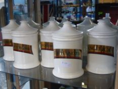Eight Culpeper Apothecary Jars, designed by Basil Ionides, hand cast and decorated, one 'Eyebright',
