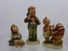 Three West German Hummel Figurines, including a boy and two girls, together with a pewter posy vase,