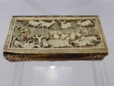 An Antique Continental Ivory and Stag Horn Table Snuff Box, depicting a hunting scene in relief,