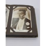 A Vintage Album of Screen Stars Photographs, some signed, including Ginger Rogers, Fred Astaire,