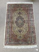 A Contemporary Turkish Style Woollen Carpet, geometric design of peach, blue and celadon green,